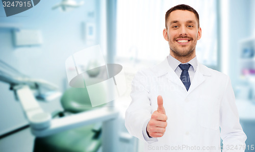 Image of smiling male doctor showing thumbs up