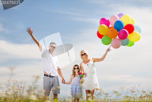 Image of family with colorful balloons