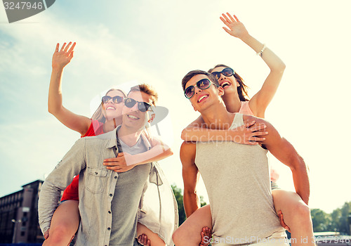 Image of smiling couple having fun in city