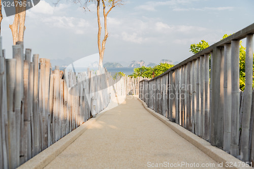 Image of road with fence at seaside