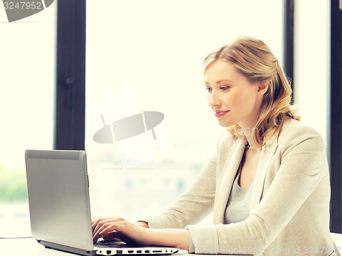 Image of happy woman with laptop computer