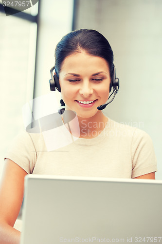 Image of helpline operator with laptop computer