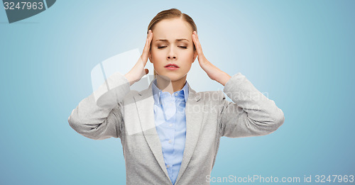 Image of stressed businesswoman having headache