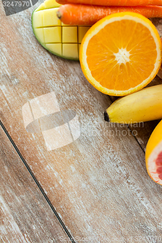 Image of close up of fresh juicy fruits on table