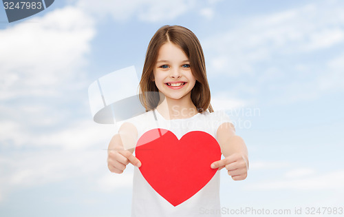 Image of smiling little girl in white blank t-shirt