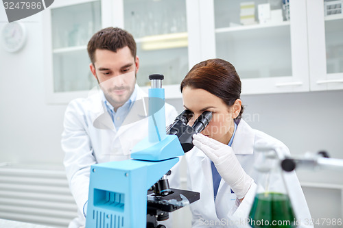 Image of young scientists making test or research in lab