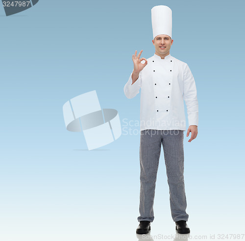 Image of happy male chef cook showing ok sign