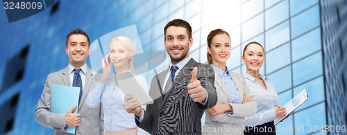 Image of group of smiling businessmen showing thumbs up