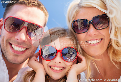 Image of happy family with blue sky