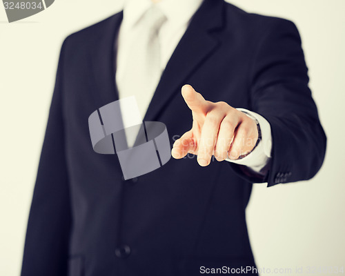 Image of man hand pointing at something