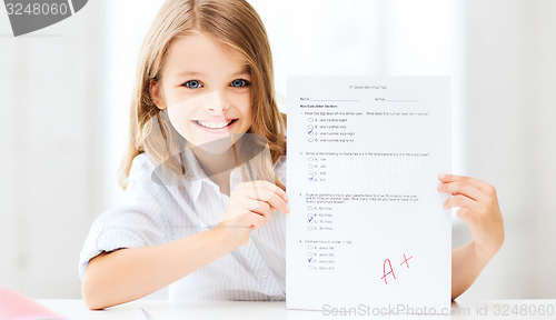 Image of girl with test and A grade at school