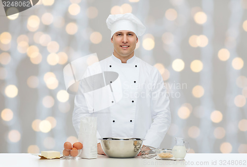 Image of happy male chef cook baking