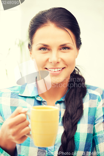 Image of lovely housewife with mug