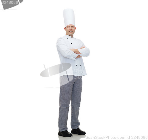 Image of happy male chef cook with crossed hands