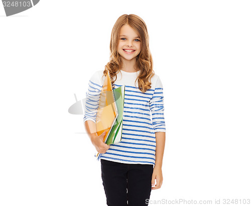 Image of child holding colorful folders