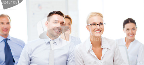Image of businessmen and businesswomen on conference