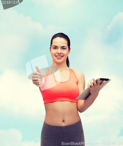 Image of sporty woman with tablet pc computer