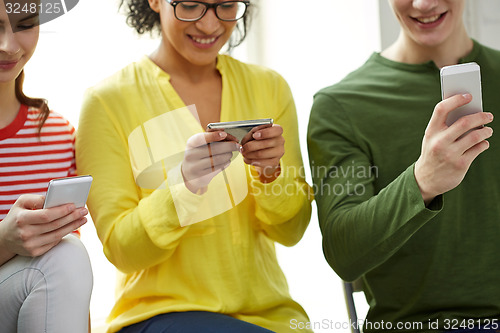 Image of close up of students with smartphones at school