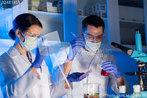 Image of close up of scientists making test in lab