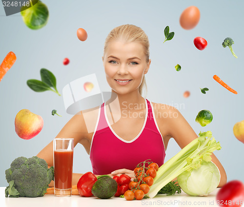 Image of happy woman with vegetarian food and vitamins