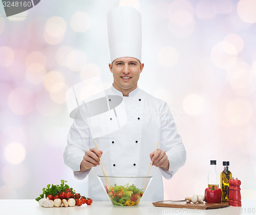 Image of happy male chef cook cooking food