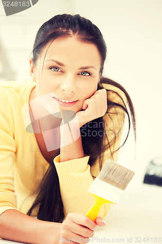 Image of lovely housewife painting