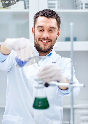 Image of young scientist making test or research in lab