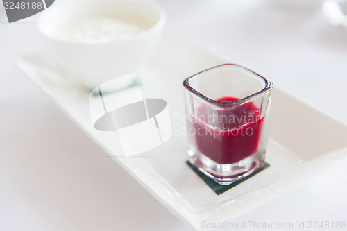 Image of close up of yogurt and jam at restaurant