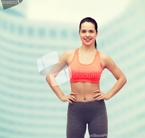 Image of smiling teenage girl in sportswear