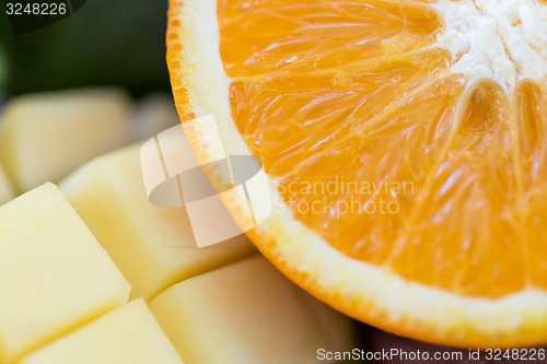 Image of close up of fresh juicy orange and mango slices