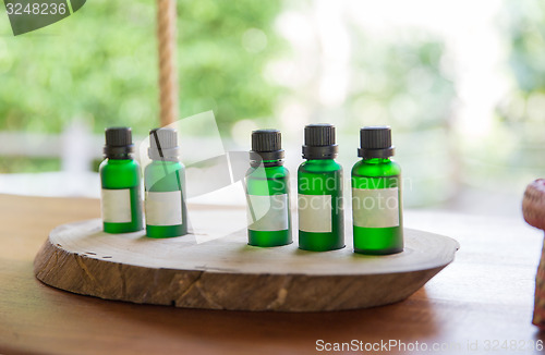 Image of close up of aromatic oil bottles set at hotel room