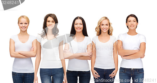 Image of group of smiling women in blank white t-shirts