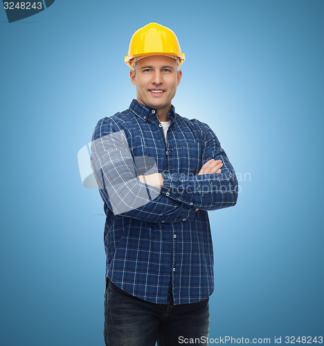 Image of smiling male builder or manual worker in helmet