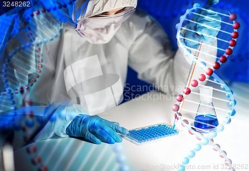 Image of close up of scientist making test in lab