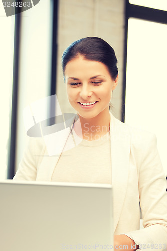 Image of happy woman with laptop computer