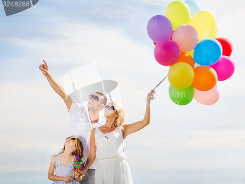 Image of family with colorful balloons