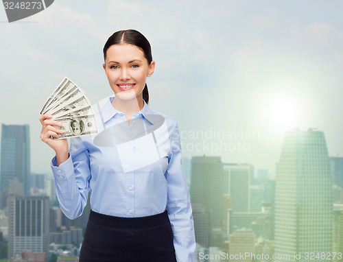 Image of businesswoman with dollar cash money