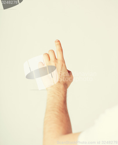 Image of man hand pointing at something