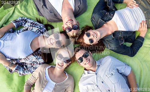 Image of group of students or teenagers lying in circle