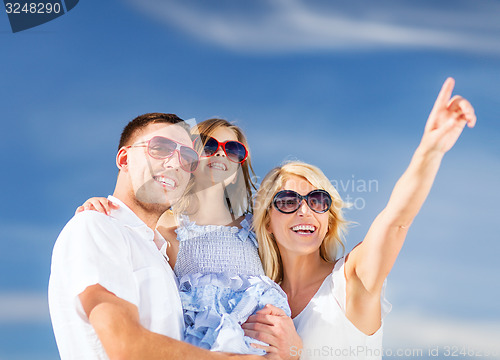 Image of happy family with blue sky