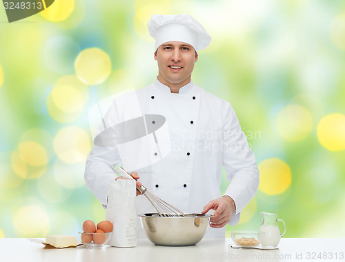 Image of happy male chef cook baking