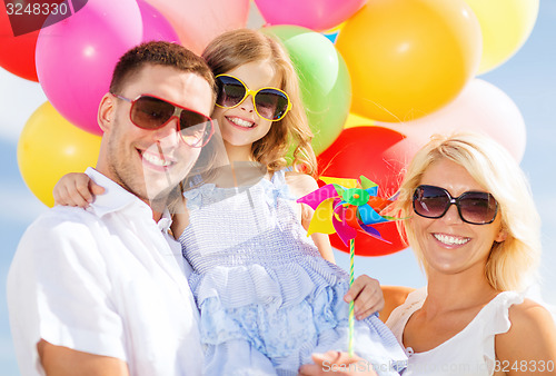 Image of family with colorful balloons