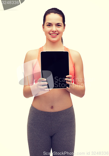 Image of sporty woman with tablet pc blank screen