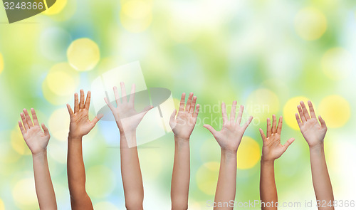 Image of people waving hands