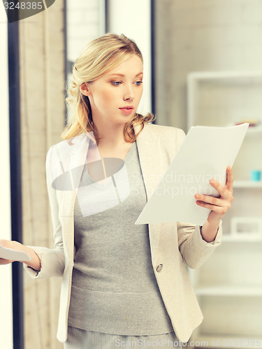 Image of calm woman with documents