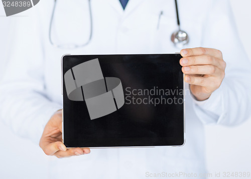 Image of male doctor holding tablet pc