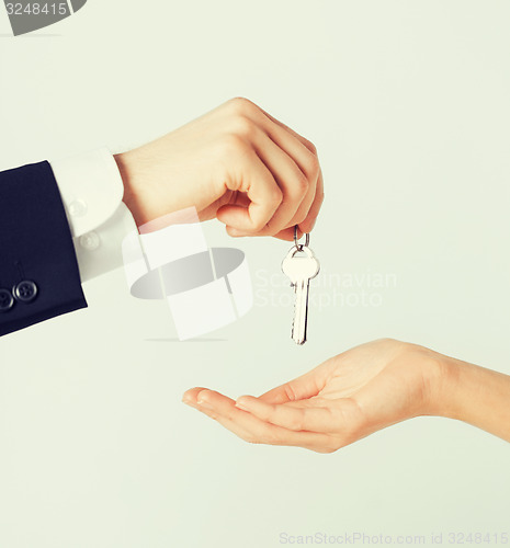 Image of man and woman with house keys