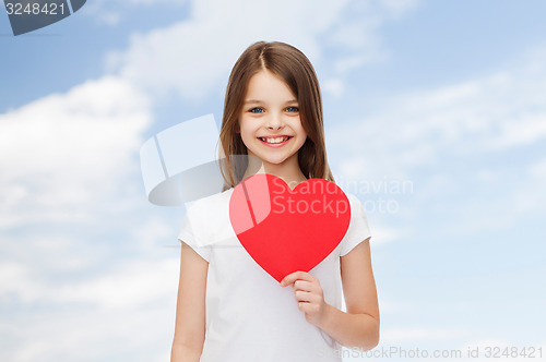 Image of smiling little girl in white blank t-shirt