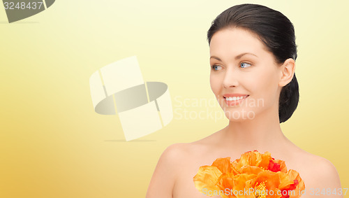 Image of beautiful young woman with flowers