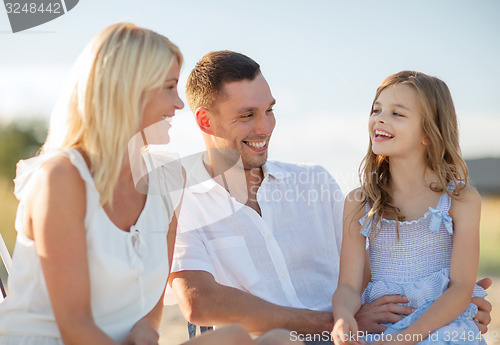 Image of happy family having a picnic